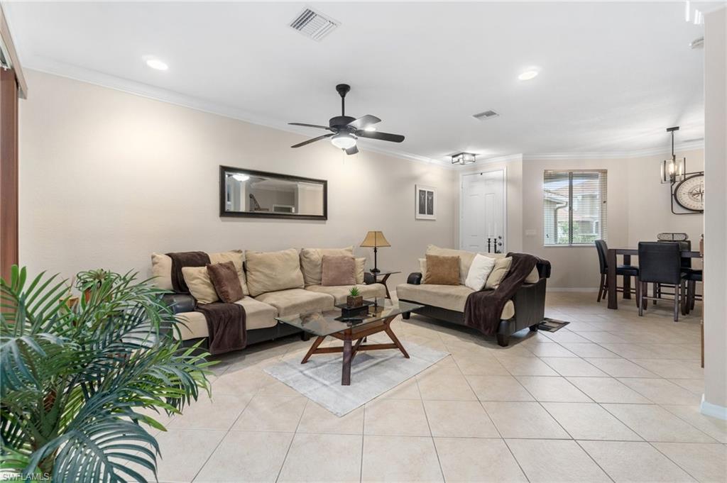 17577 Brickstone Loop Fort Myers, FL 33967 - Photo 7 of 33 a living room with furniture and a chandelier