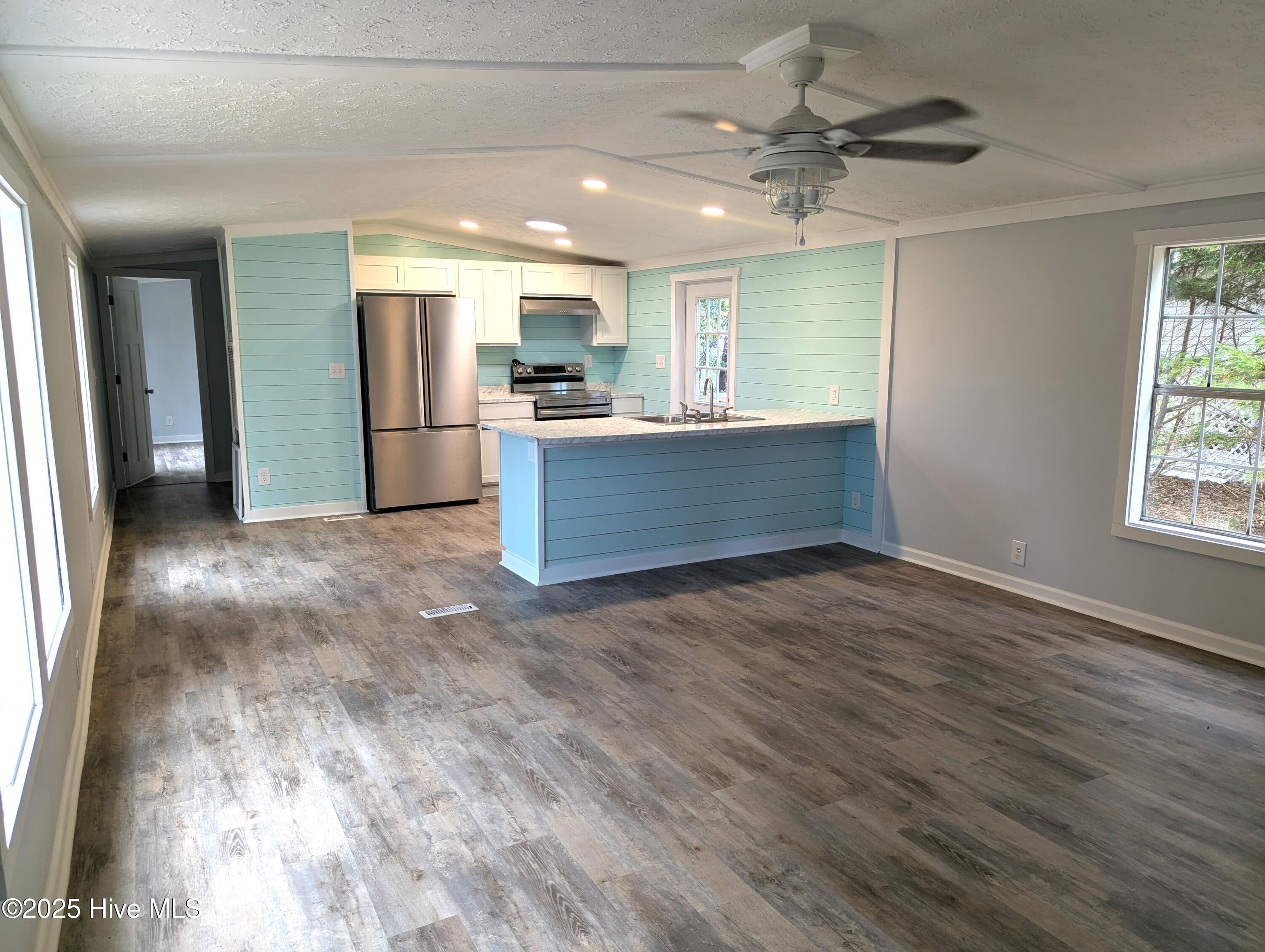 1587 Snapper Street Southwest Shallotte, NC 28470 - Photo 3 of 19 Living room/Kitchen