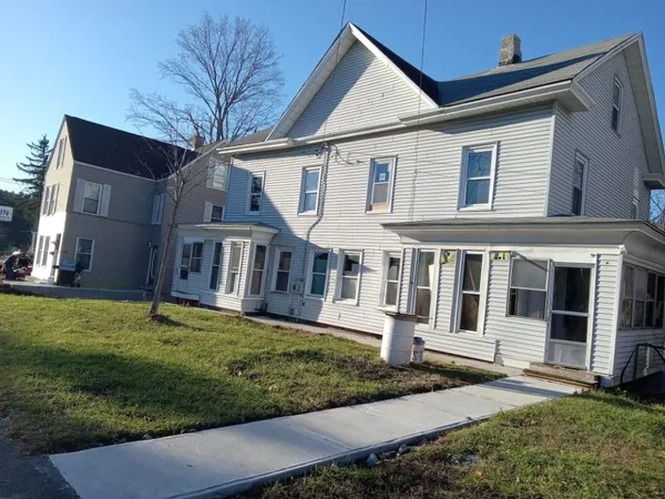 front view of a house with a yard