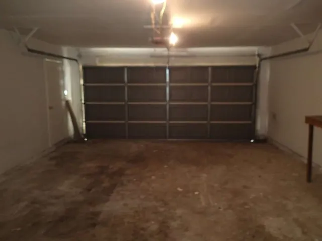 a view of an empty room with empty shelves