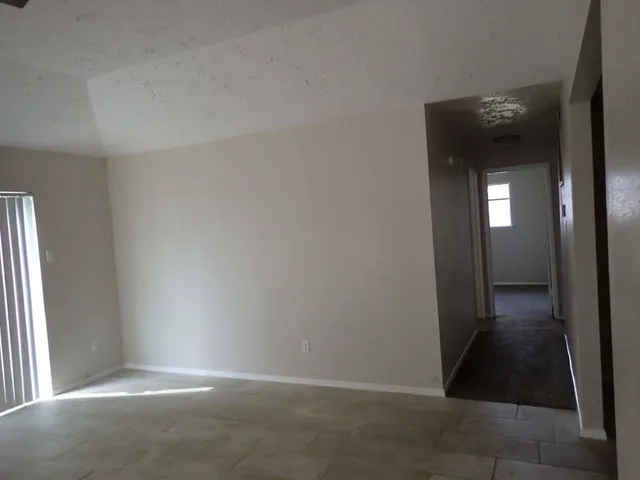 an empty room with mirror