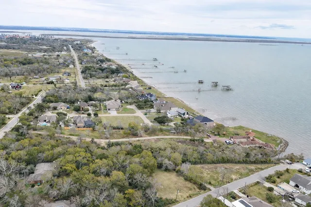 a view of outdoor space with green field and trees all around
