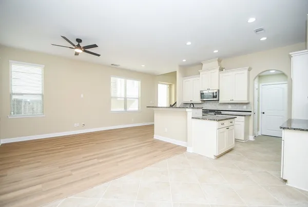 an empty room with a closet and wooden floor