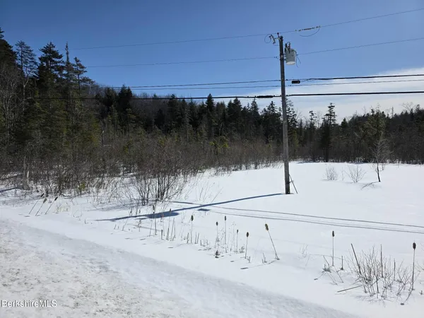 a view of a road with a building in the background
