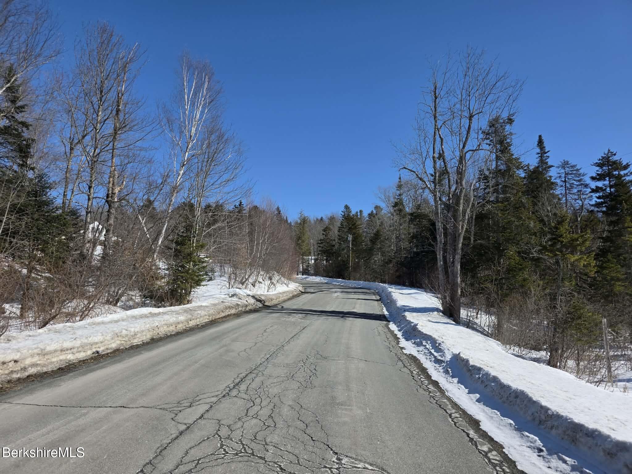 26 Loop Road Savoy, MA 01256 - Photo 5 of 8 a view of a road with a building in the background