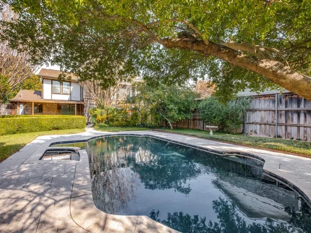 a view of a swimming pool with a patio