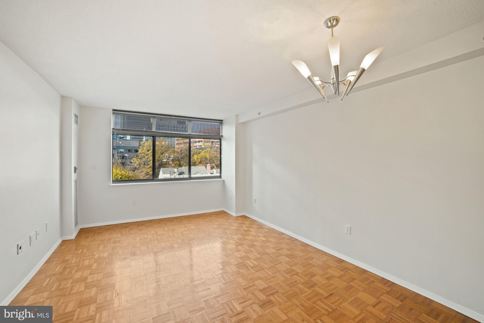 7111 Woodmont Avenue, Unit 514 Chevy Chase, MD 20815 - Photo 11 of 38 an empty room with a window