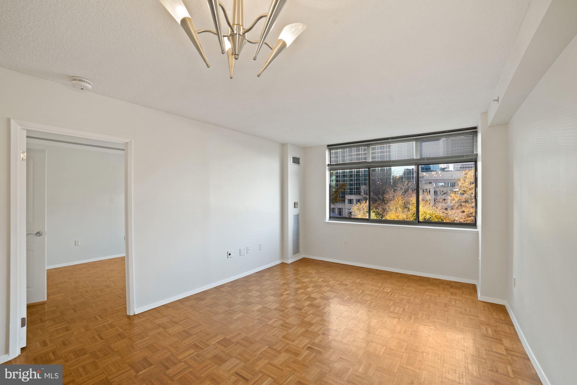 7111 Woodmont Avenue, Unit 514 Chevy Chase, MD 20815 - Photo 14 of 38 an empty room with a window