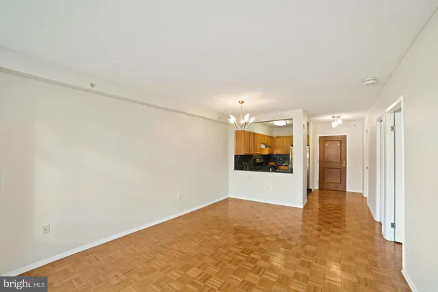 a view of hallway with wooden floor