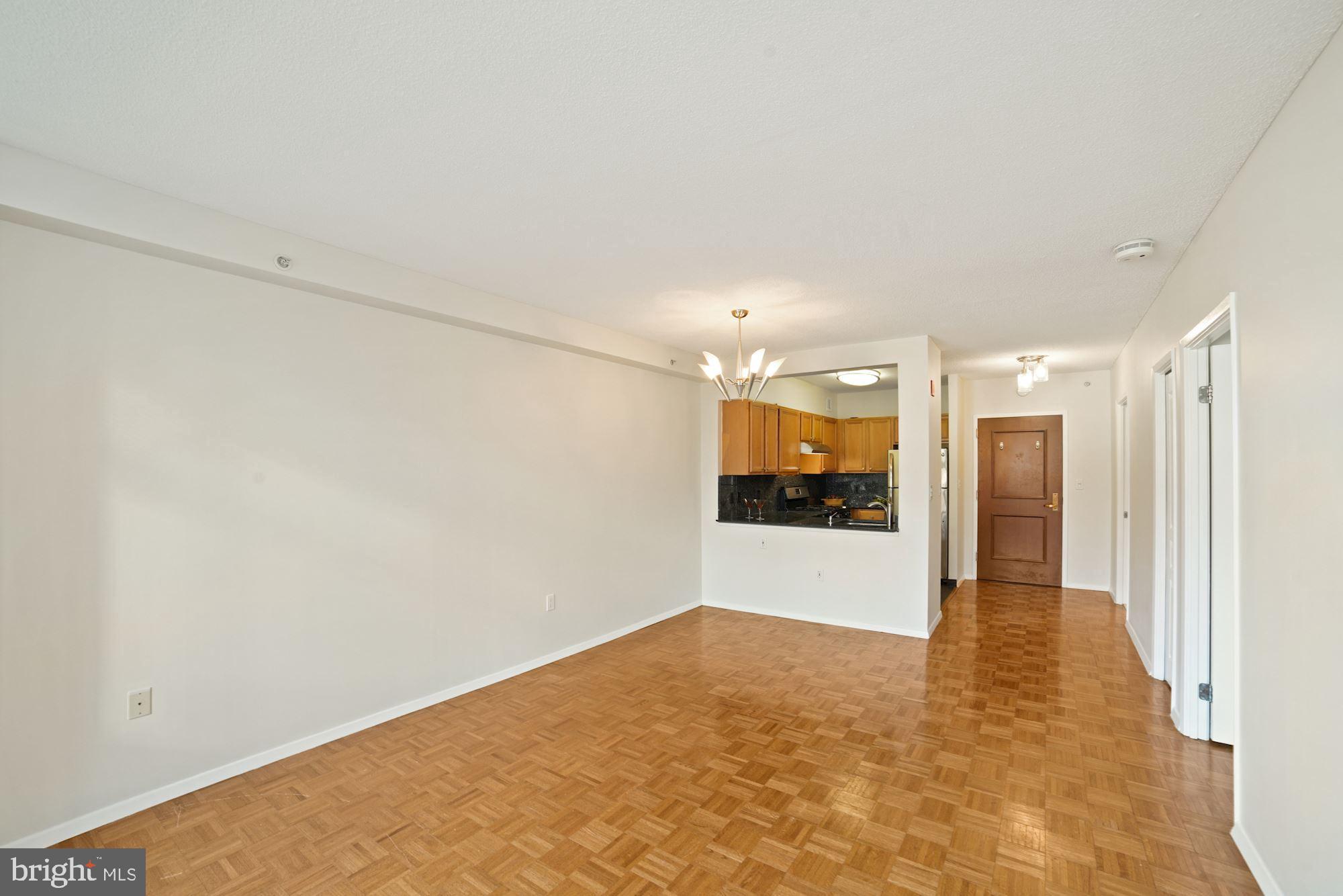 7111 Woodmont Avenue, Unit 514 Chevy Chase, MD 20815 - Photo 18 of 38 a view of hallway with wooden floor