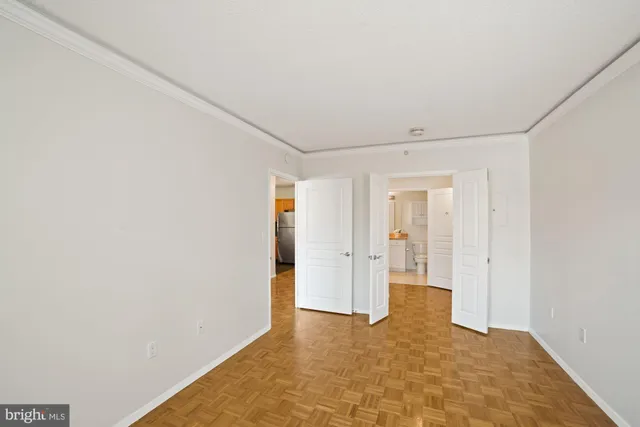 a view of a big room with closet and wooden door