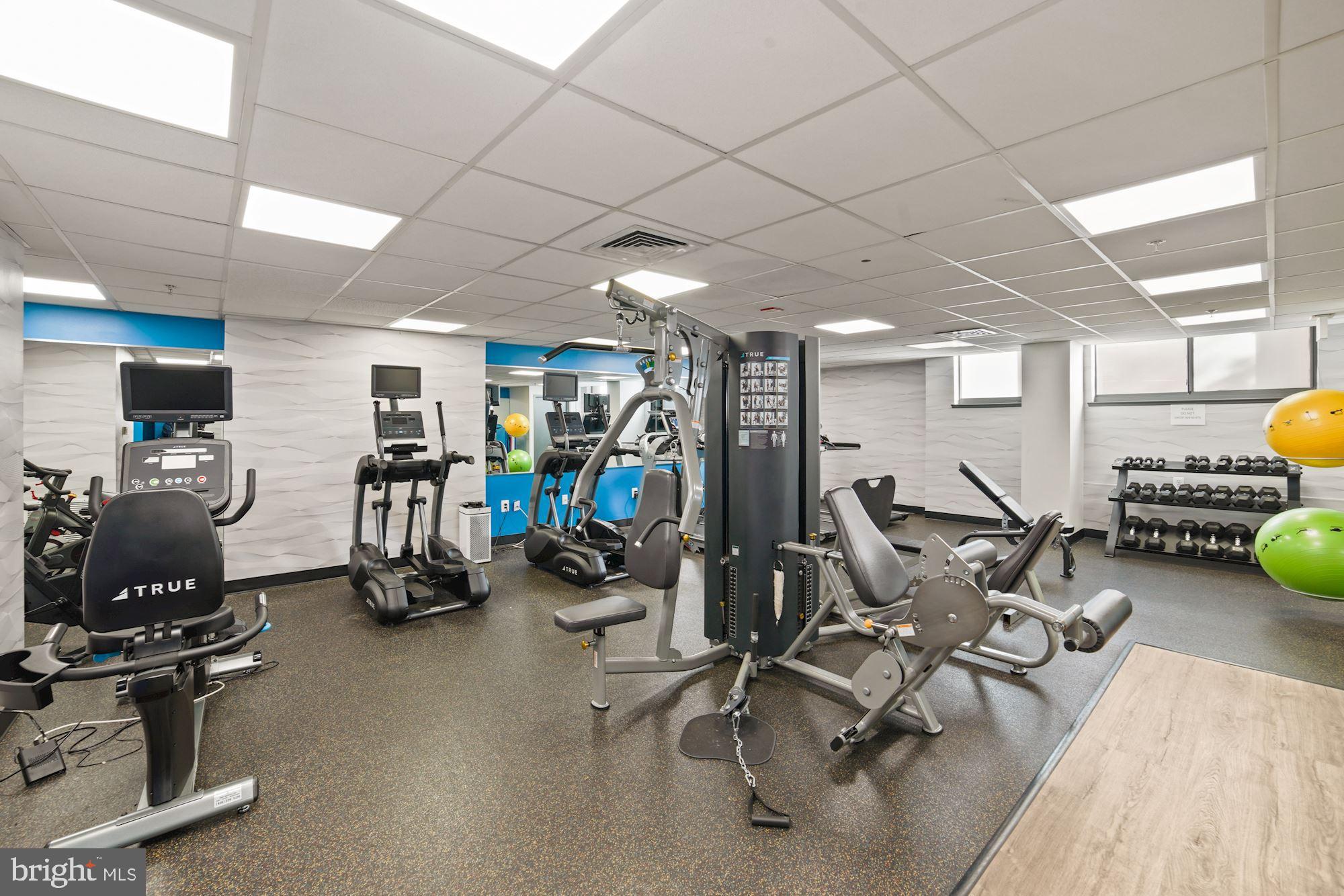 7111 Woodmont Avenue, Unit 514 Chevy Chase, MD 20815 - Photo 29 of 38 a view of a room with gym equipment