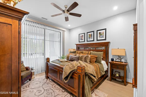 a bathroom with a double vanity sink mirror and shower