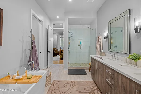 a bathroom with a double vanity sink and a mirror