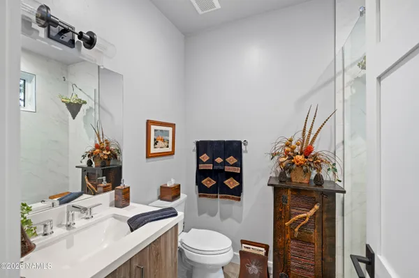 a kitchen with a sink cabinets and a window