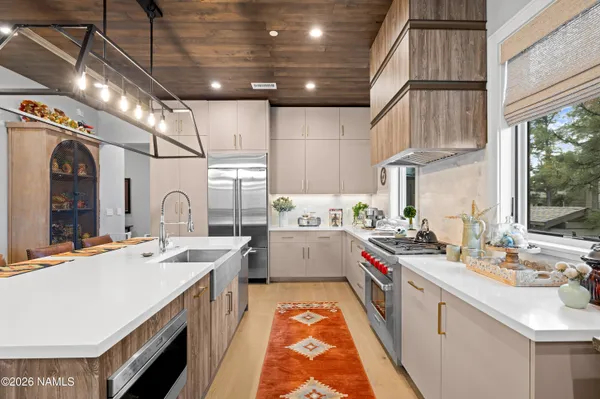 a kitchen that has a lot of cabinets in it