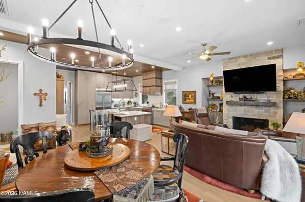 a room with fireplace lots of furniture and a flat screen tv