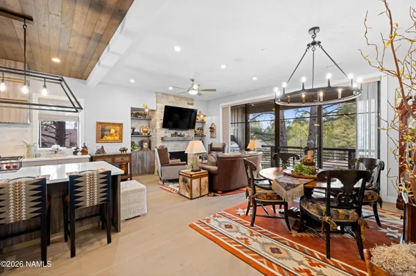 a living room with lots of furniture and a flat screen tv