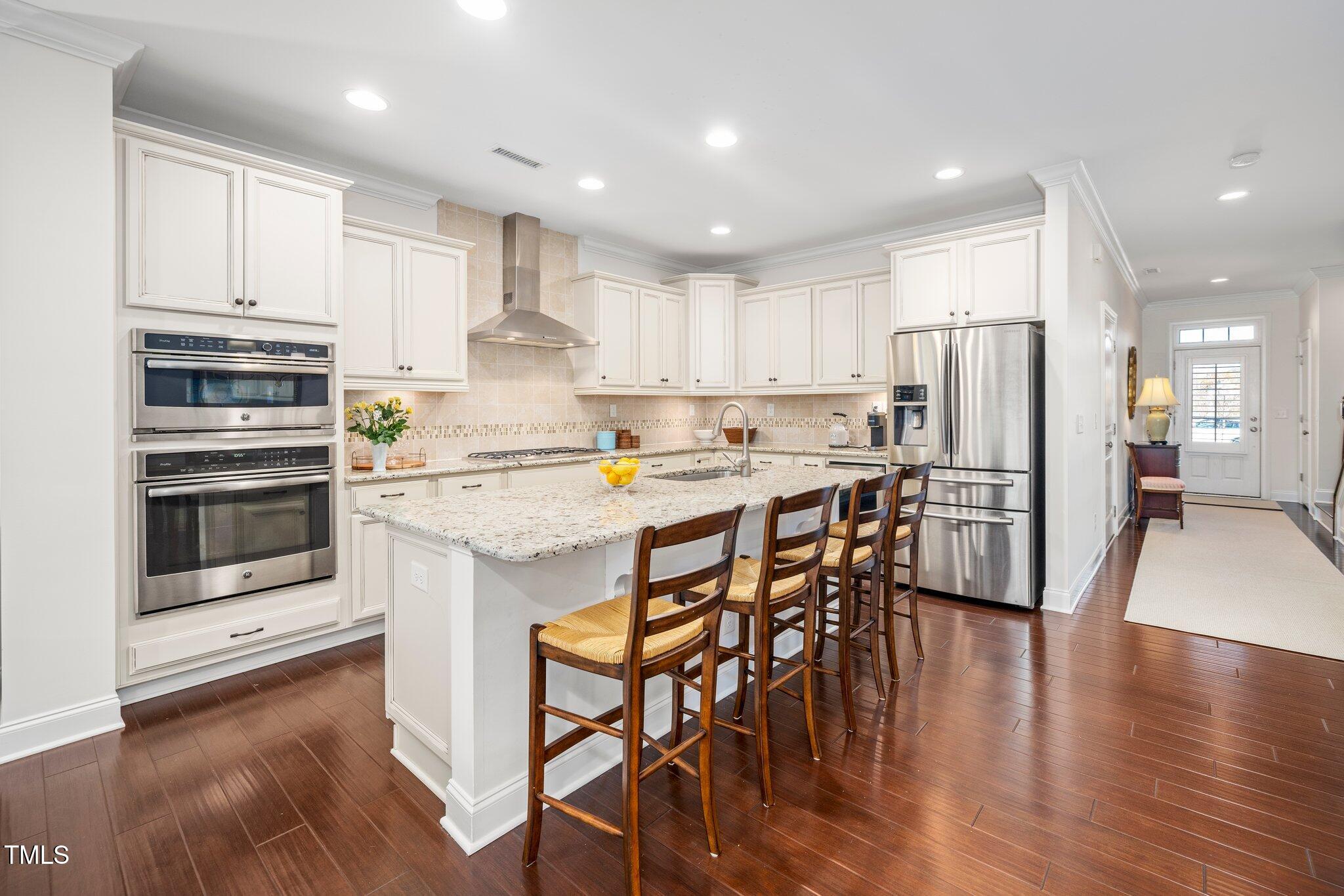 512 Fallon Grove Way Raleigh, NC 27608 - Photo 13 of 34 Kitchen with high end appliances and island