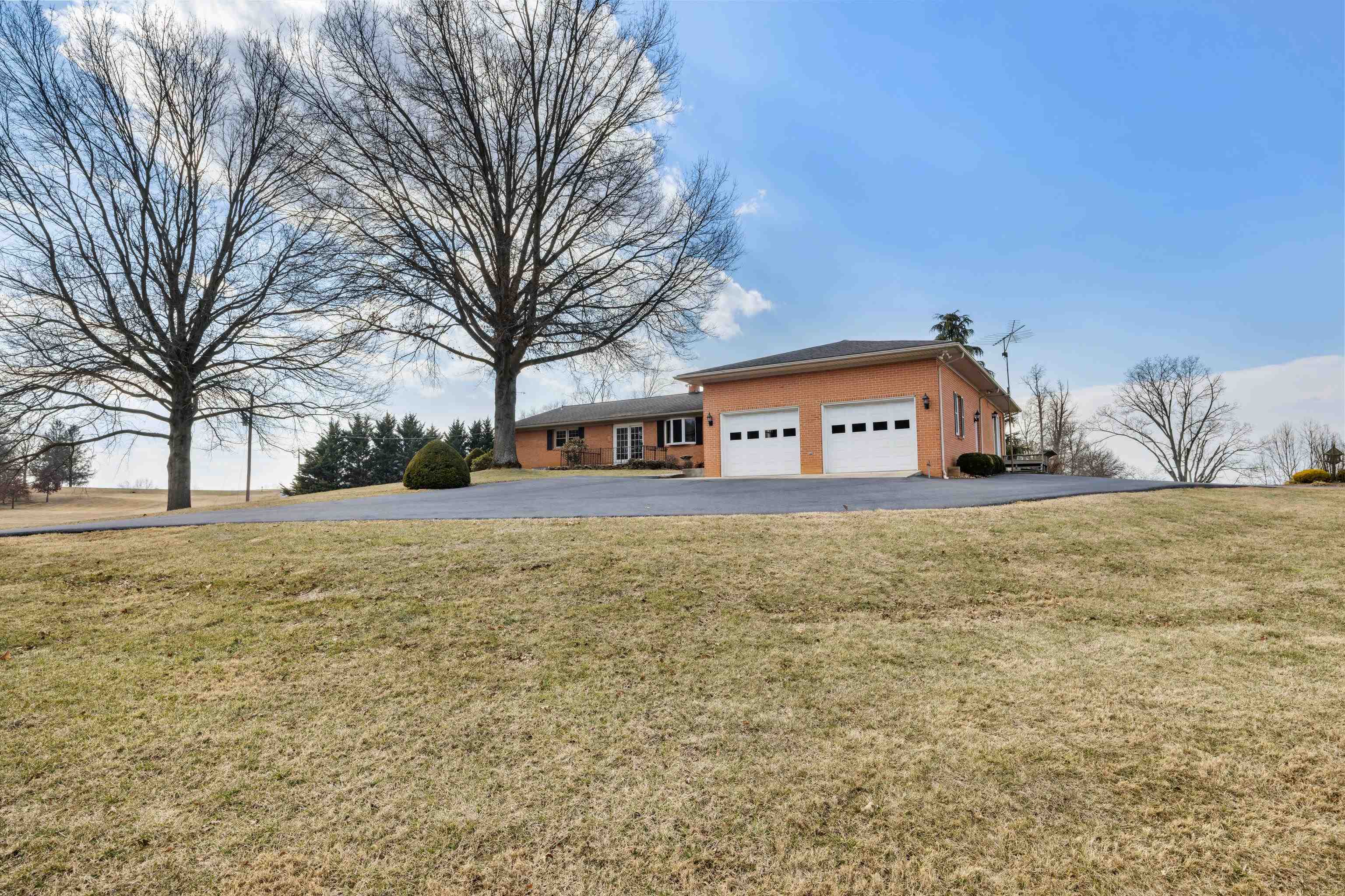 431 Mt Pisgah Road Mount Sidney, VA 24467 - Photo 18 of 72 a large house with a big yard and large trees