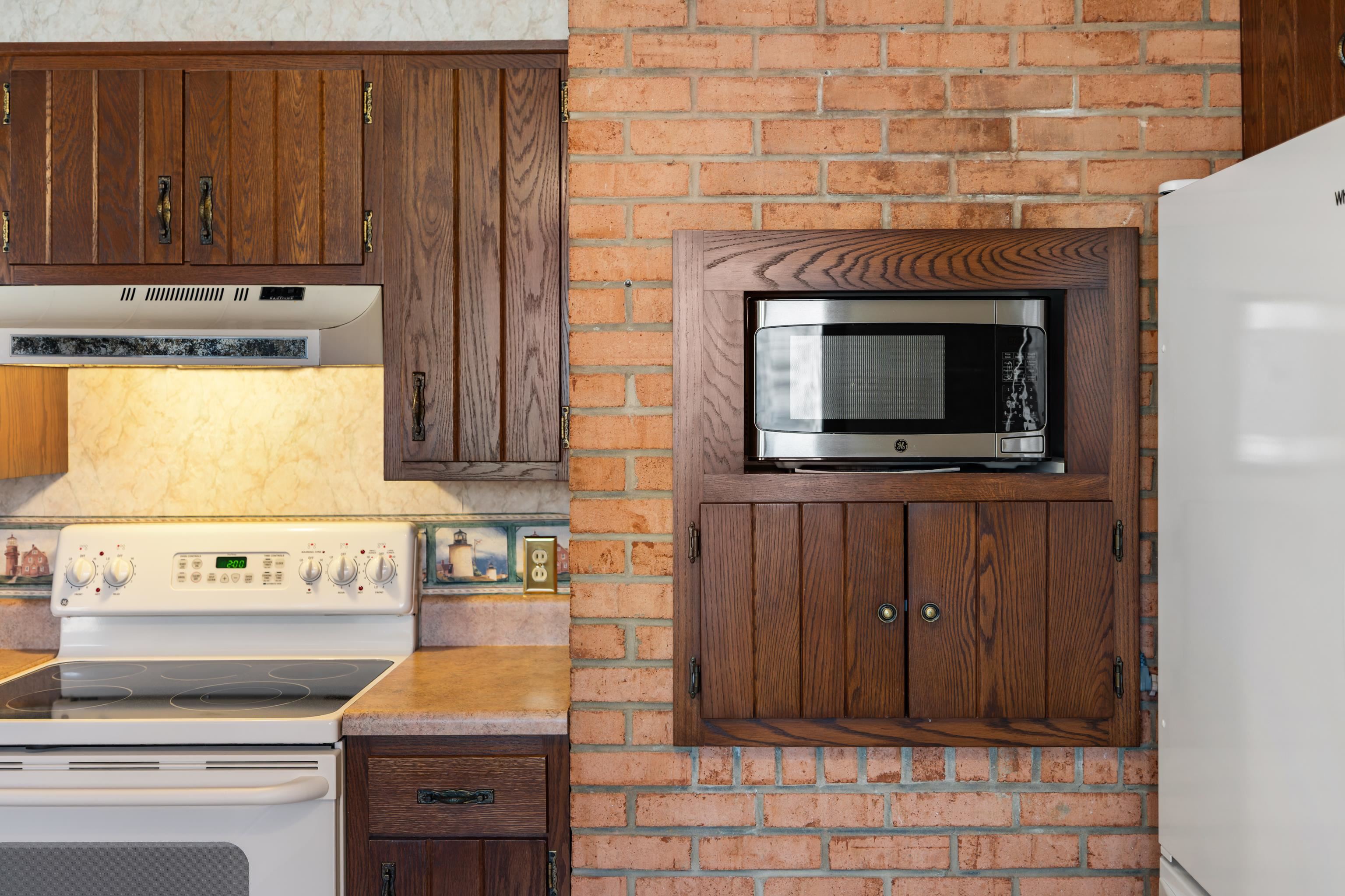 431 Mt Pisgah Road Mount Sidney, VA 24467 - Photo 25 of 72 a kitchen with a stove and a microwave