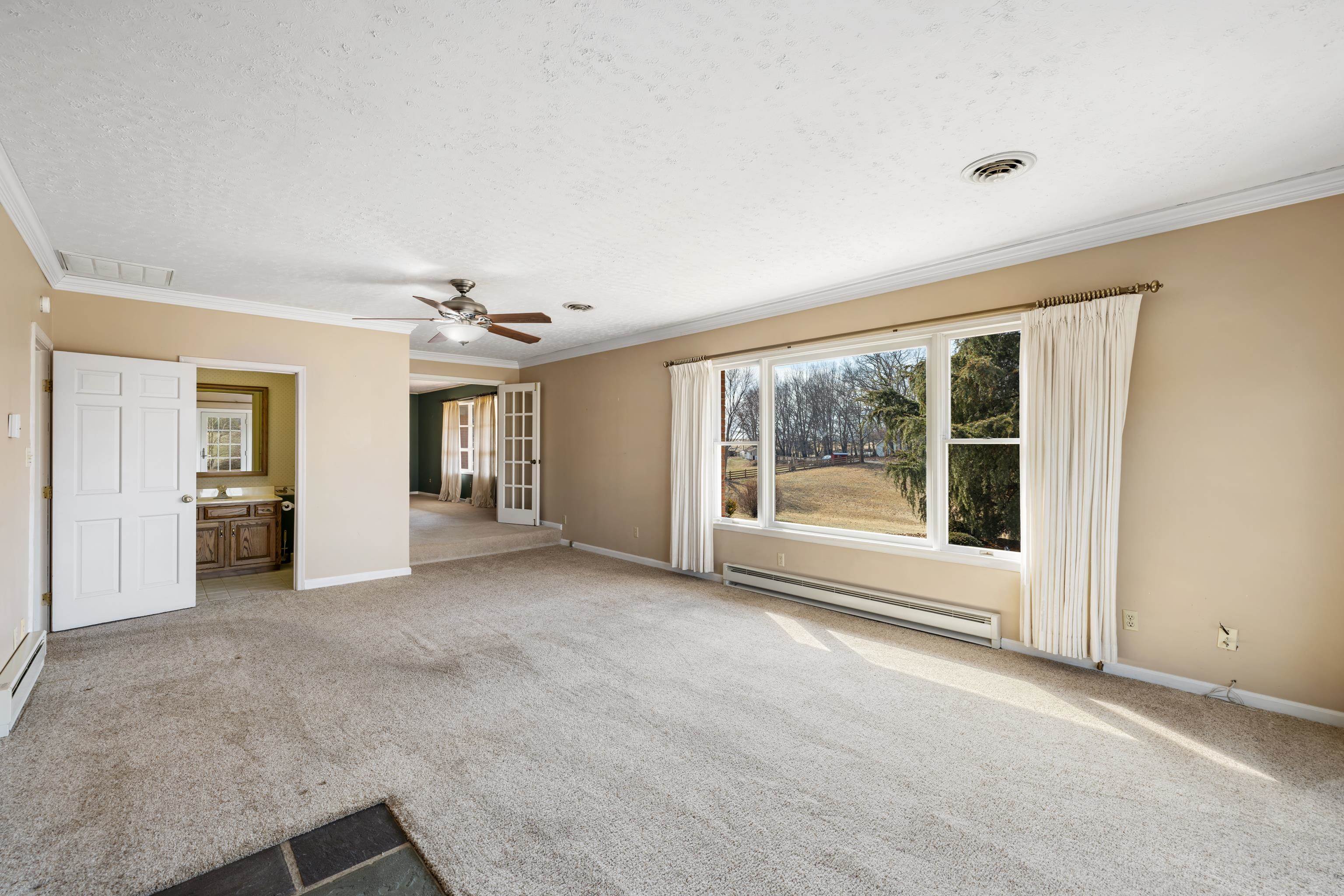 431 Mt Pisgah Road Mount Sidney, VA 24467 - Photo 36 of 72 a view of an empty room with a fireplace and a window