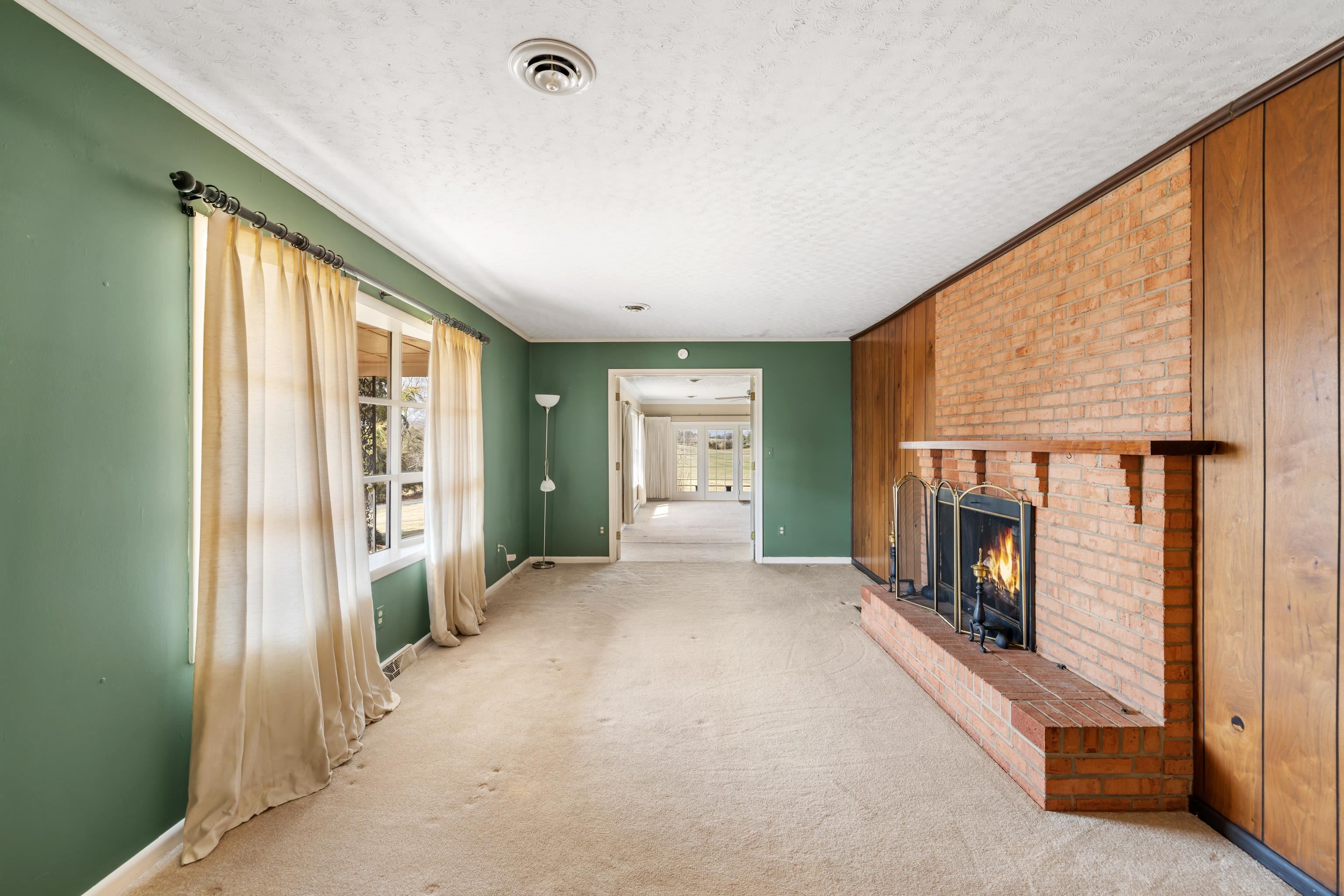 431 Mt Pisgah Road Mount Sidney, VA 24467 - Photo 42 of 72 a view of a livingroom with a fireplace and window