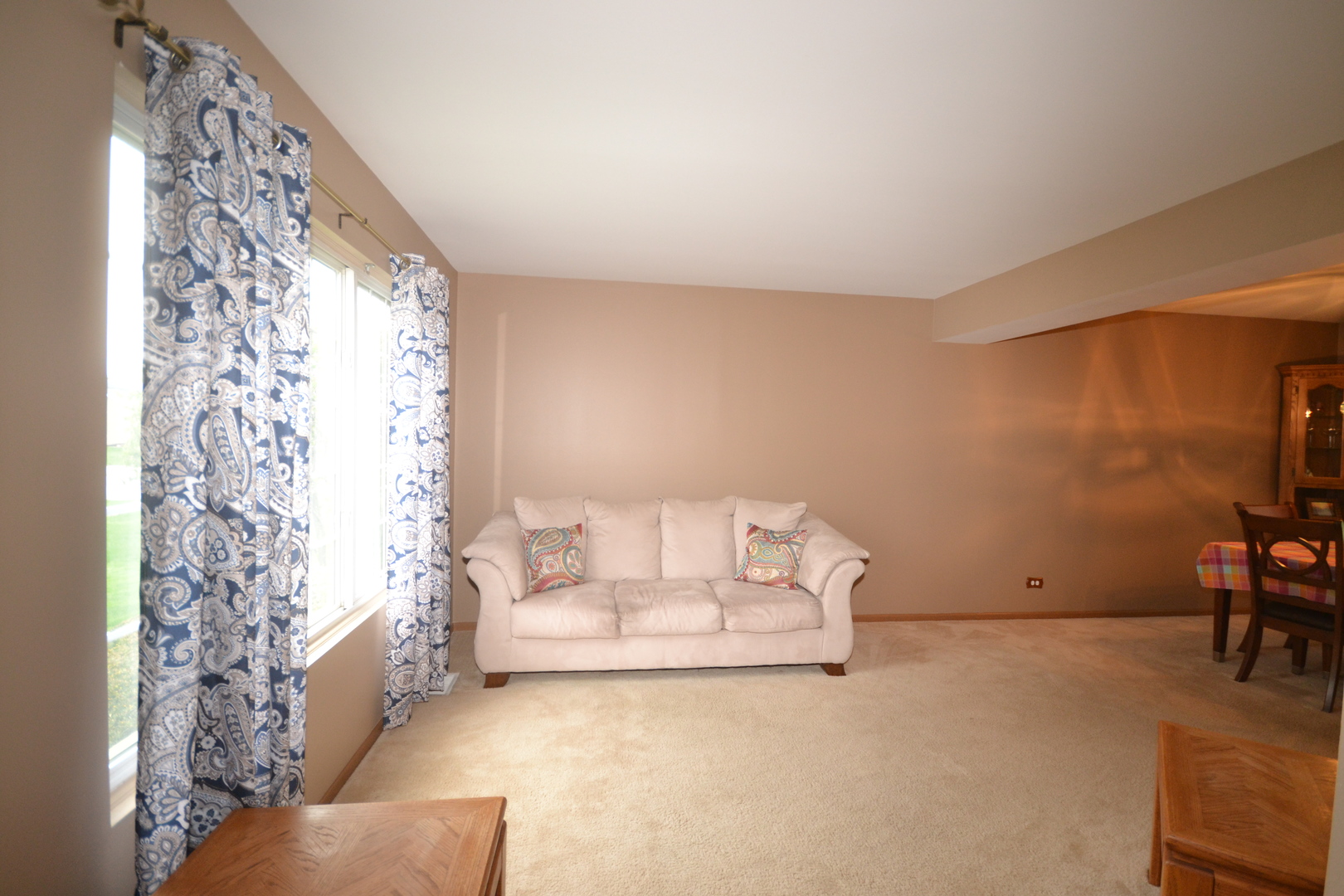 1113 Sawmill Lane Algonquin, IL 60102 - Photo 13 of 33 a living room with a couch and a table with wooden floor