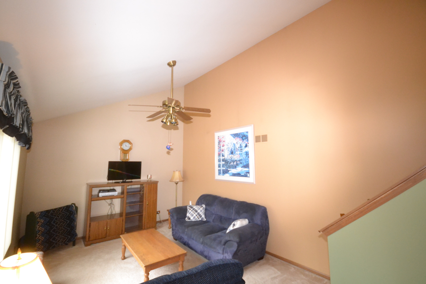 1113 Sawmill Lane Algonquin, IL 60102 - Photo 3 of 33 a living room with furniture a chandelier and a flat screen tv