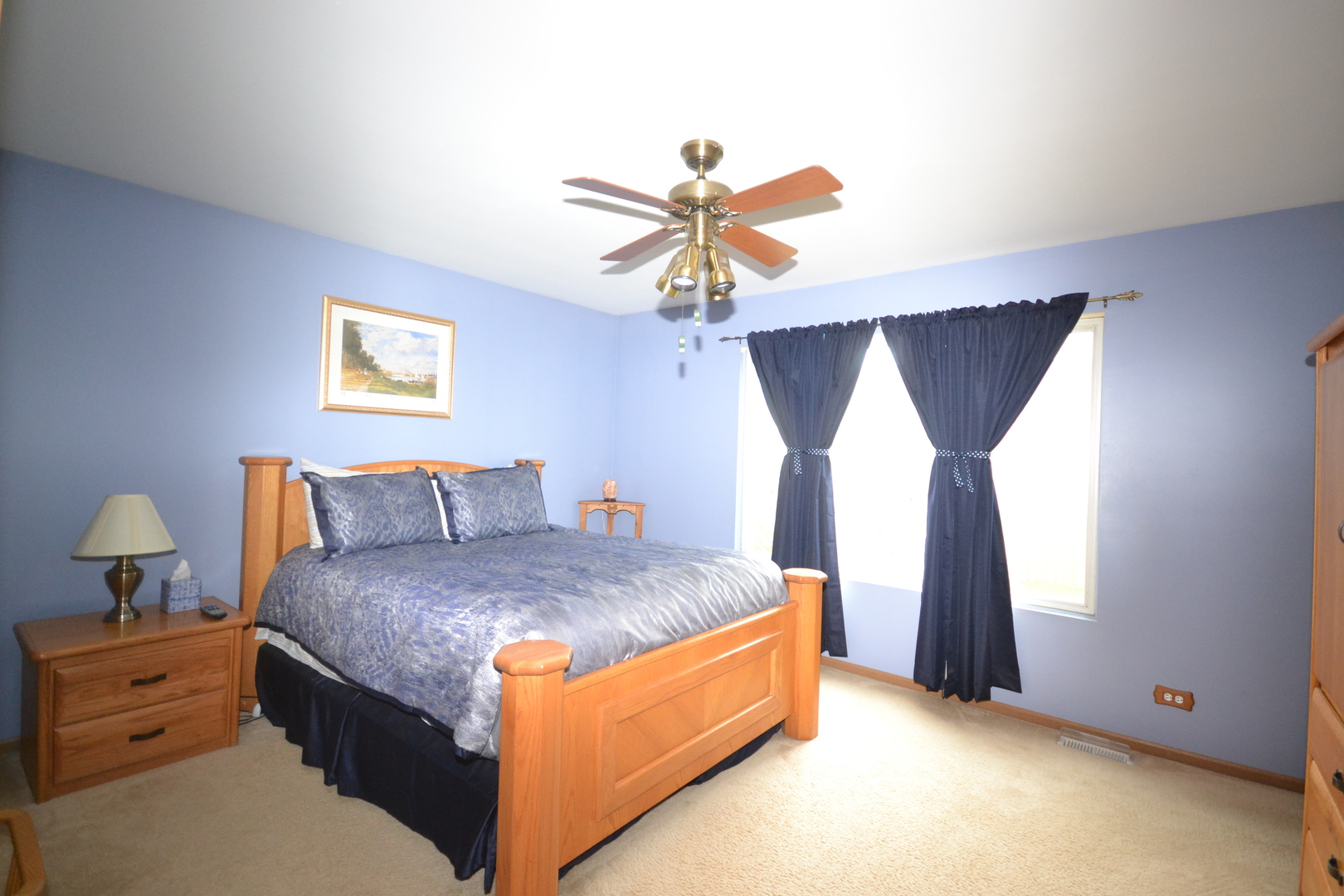1113 Sawmill Lane Algonquin, IL 60102 - Photo 22 of 33 a spacious bedroom with a bed and a chandelier