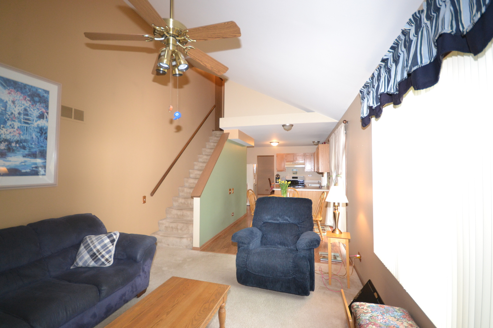 1113 Sawmill Lane Algonquin, IL 60102 - Photo 4 of 33 a living room with couches and a potted plant on a coffee table