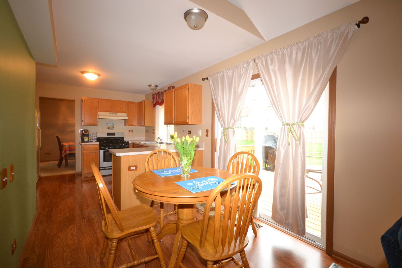 1113 Sawmill Lane Algonquin, IL 60102 - Photo 5 of 33 a dining room with furniture a window and wooden floor
