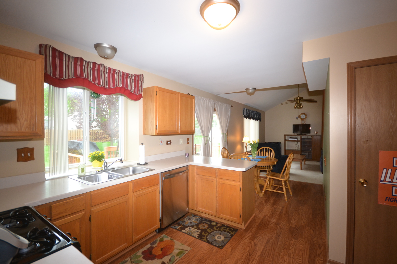 1113 Sawmill Lane Algonquin, IL 60102 - Photo 10 of 33 a kitchen with granite countertop a stove a sink and a refrigerator