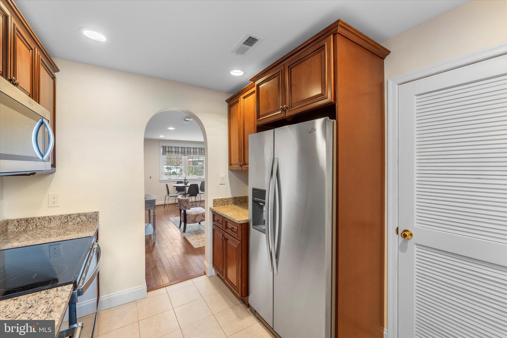 1527 K Street Southeast Washington, DC 20003 - Photo 12 of 27 a kitchen with stainless steel appliances granite countertop a refrigerator and a stove