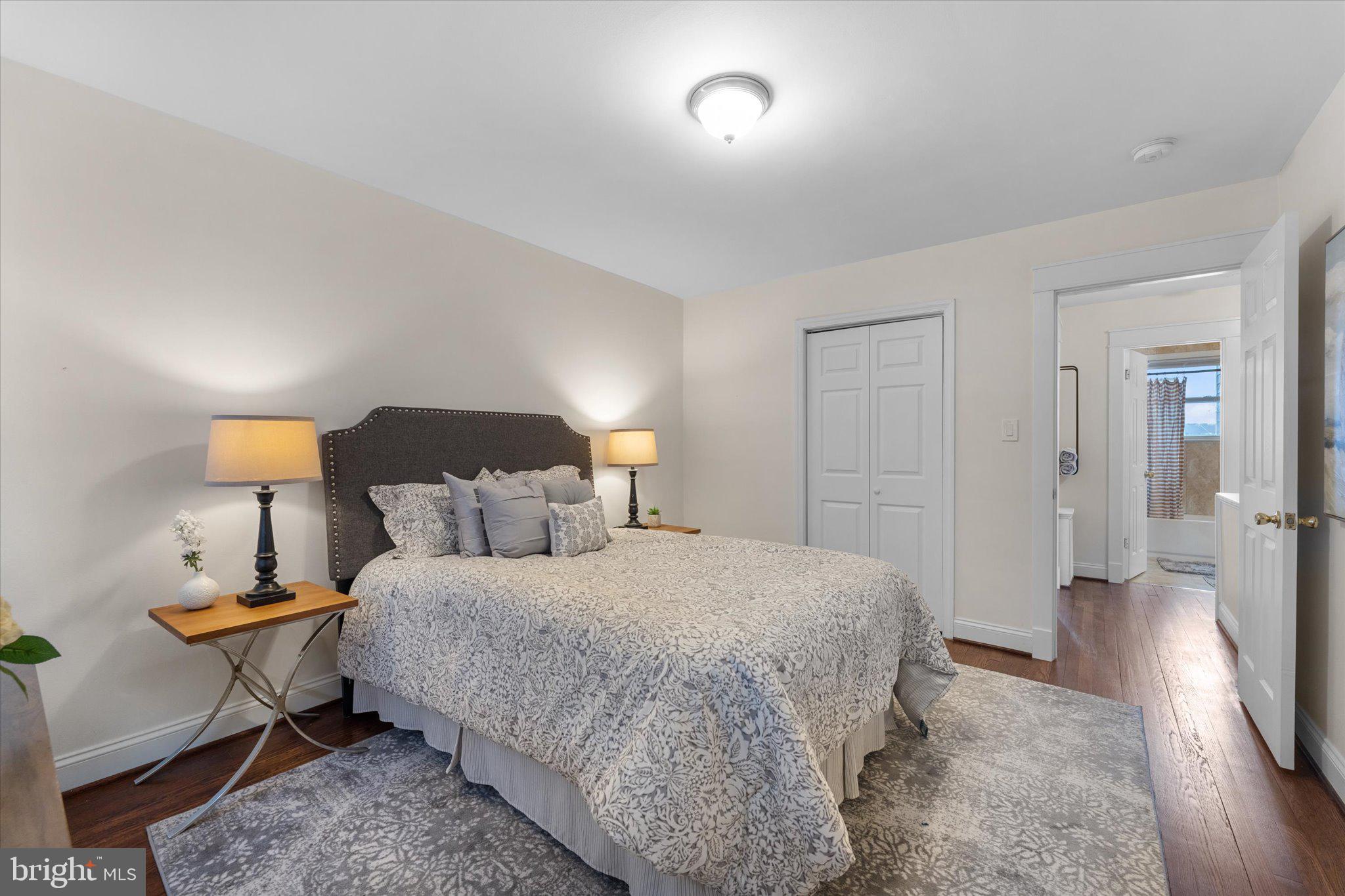 1527 K Street Southeast Washington, DC 20003 - Photo 18 of 27 a bedroom with a bed and a lamp on table