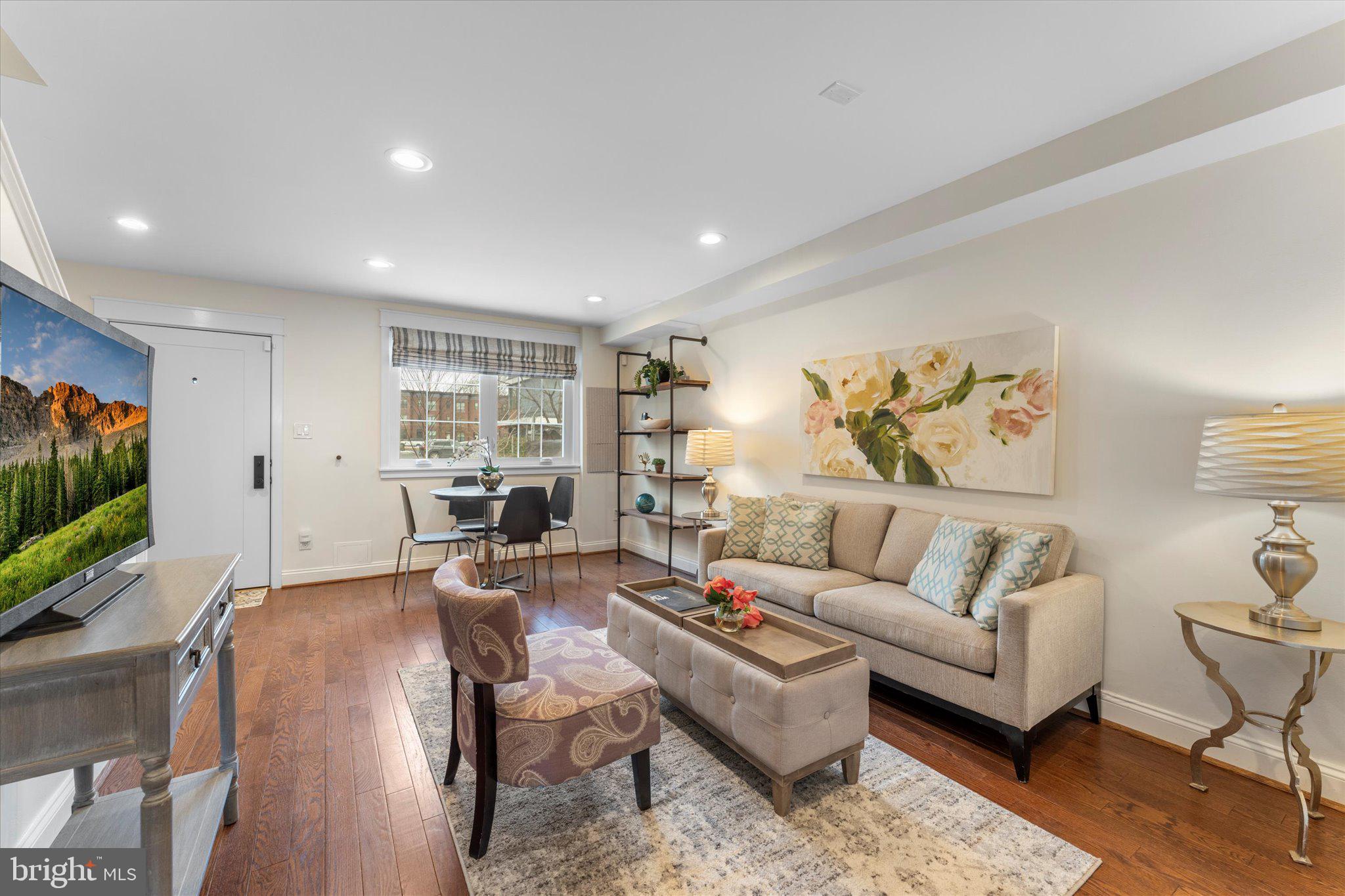 1527 K Street Southeast Washington, DC 20003 - Photo 2 of 27 a living room with furniture and a flat screen tv