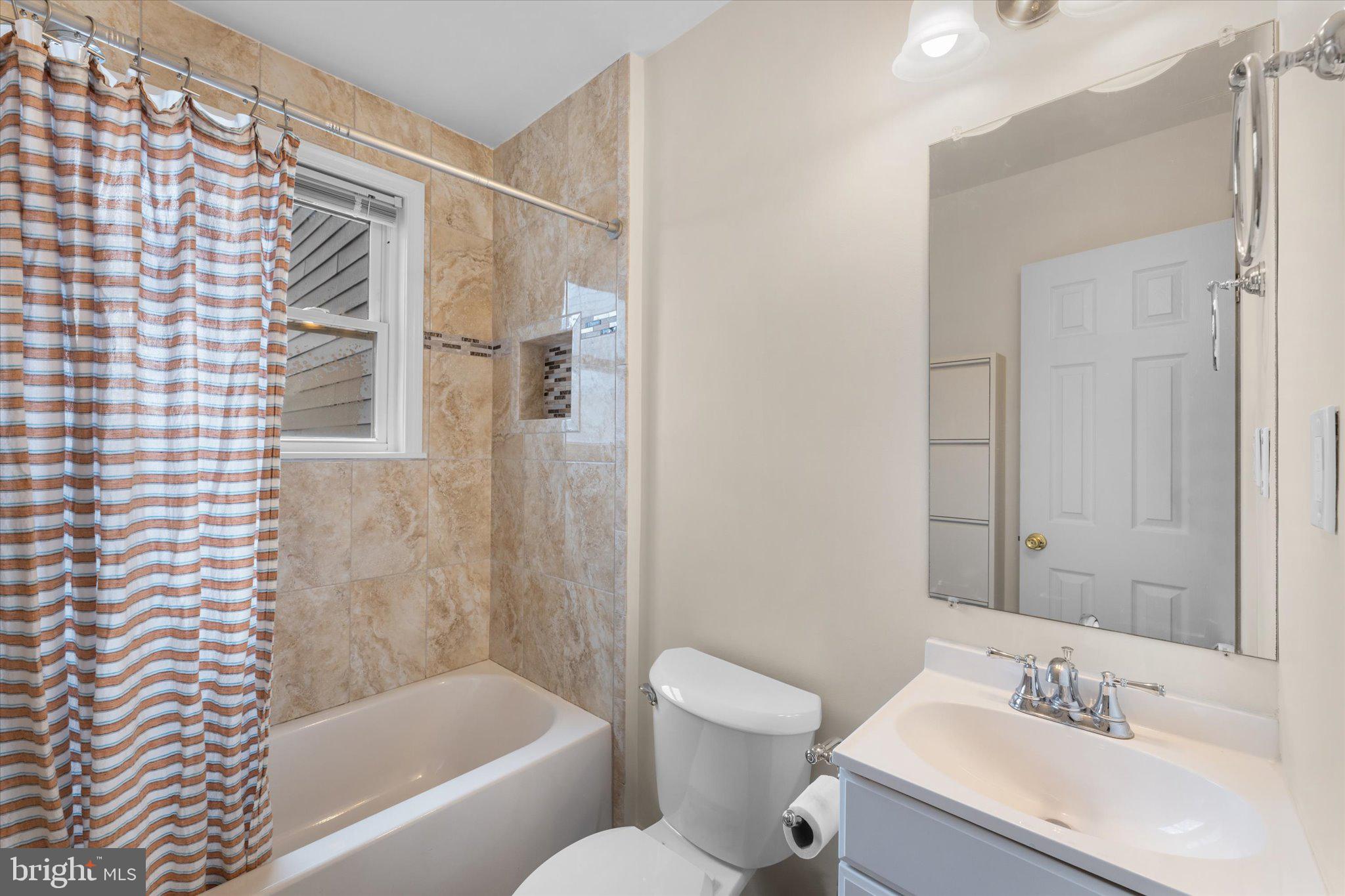 1527 K Street Southeast Washington, DC 20003 - Photo 21 of 27 a bathroom with a bathtub shower sink vanity and toilet