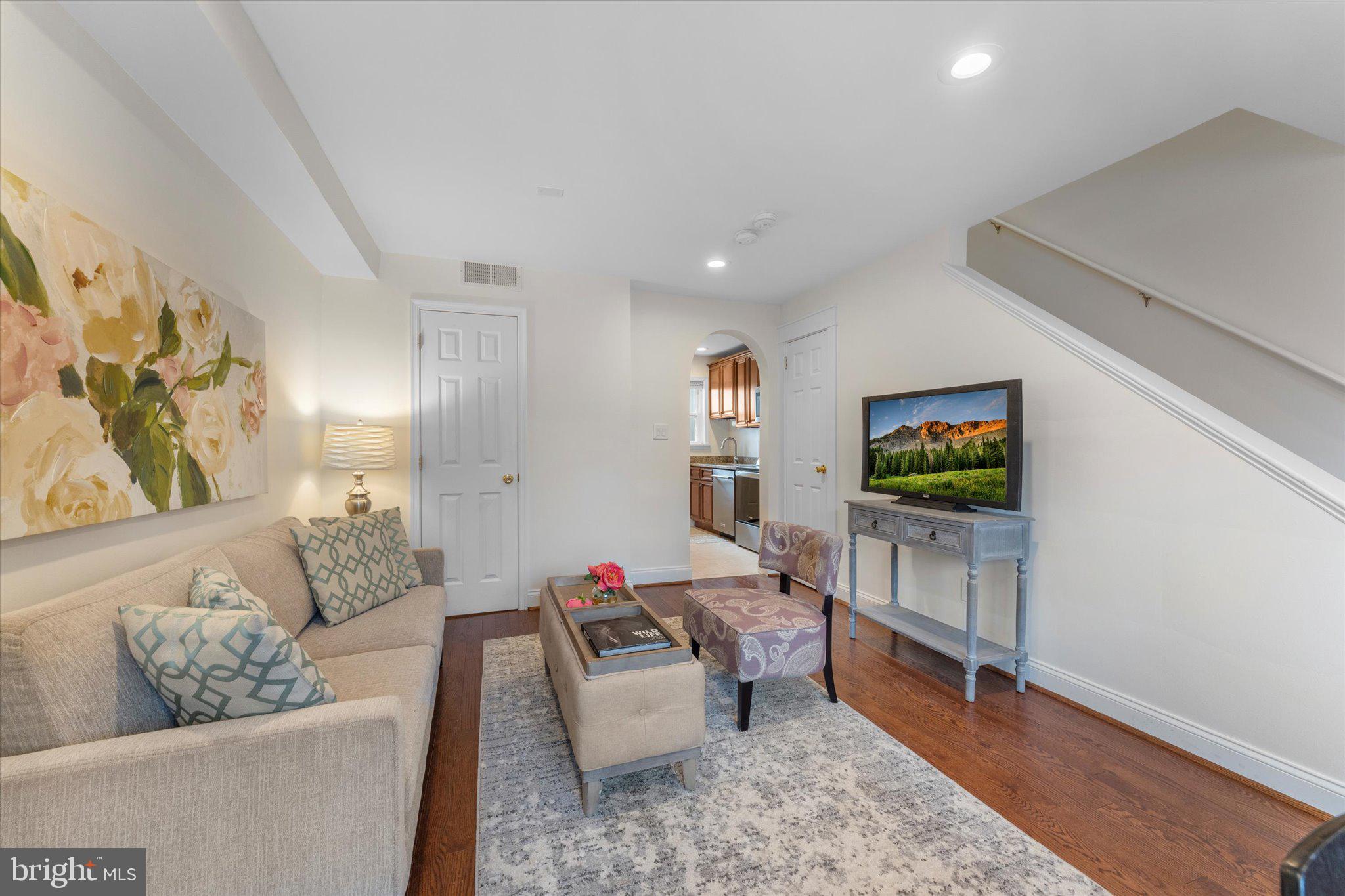 1527 K Street Southeast Washington, DC 20003 - Photo 6 of 27 a living room with furniture and a flat screen tv