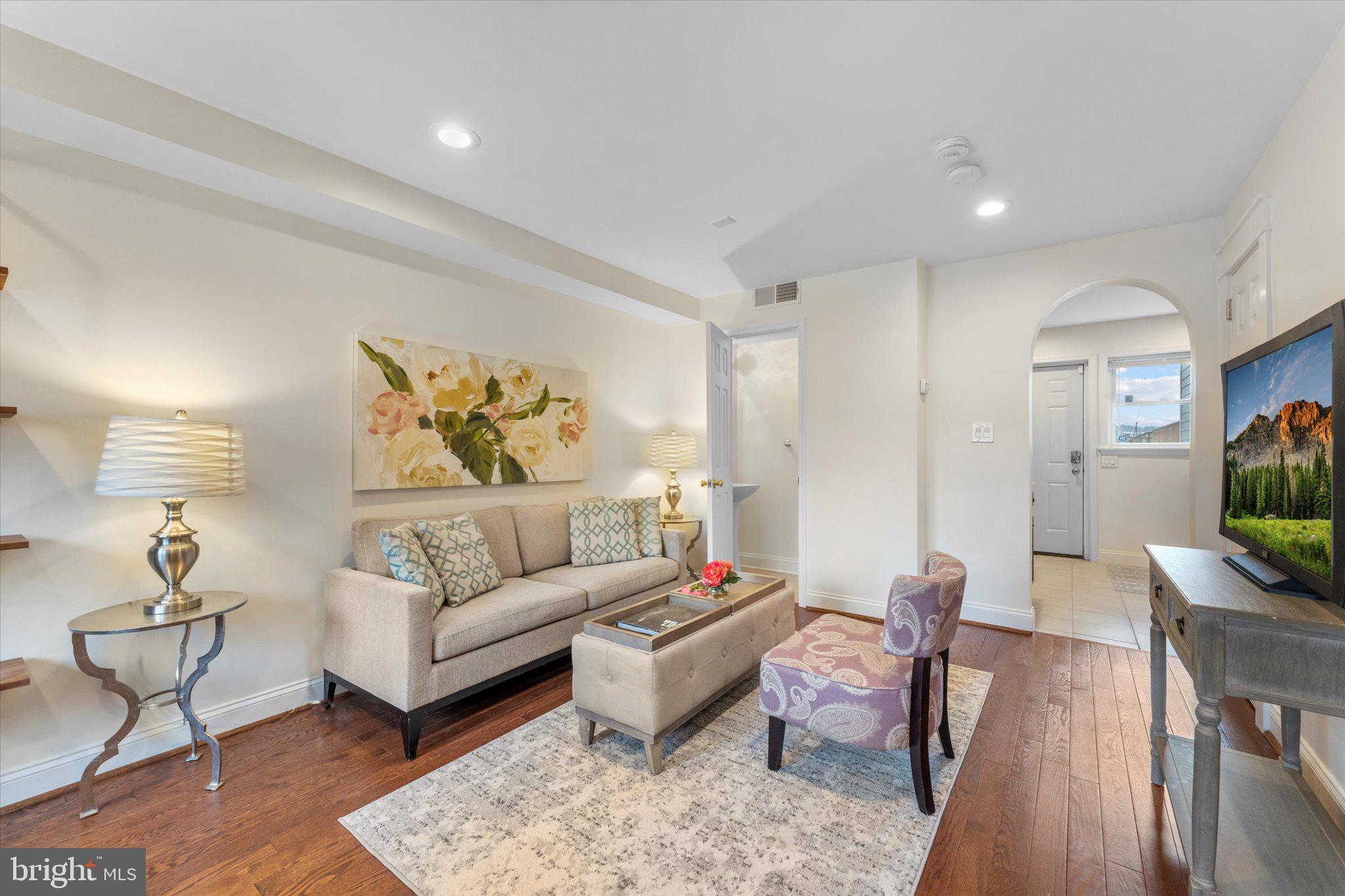 1527 K Street Southeast Washington, DC 20003 - Photo 7 of 27 a living room with furniture and a wooden floor