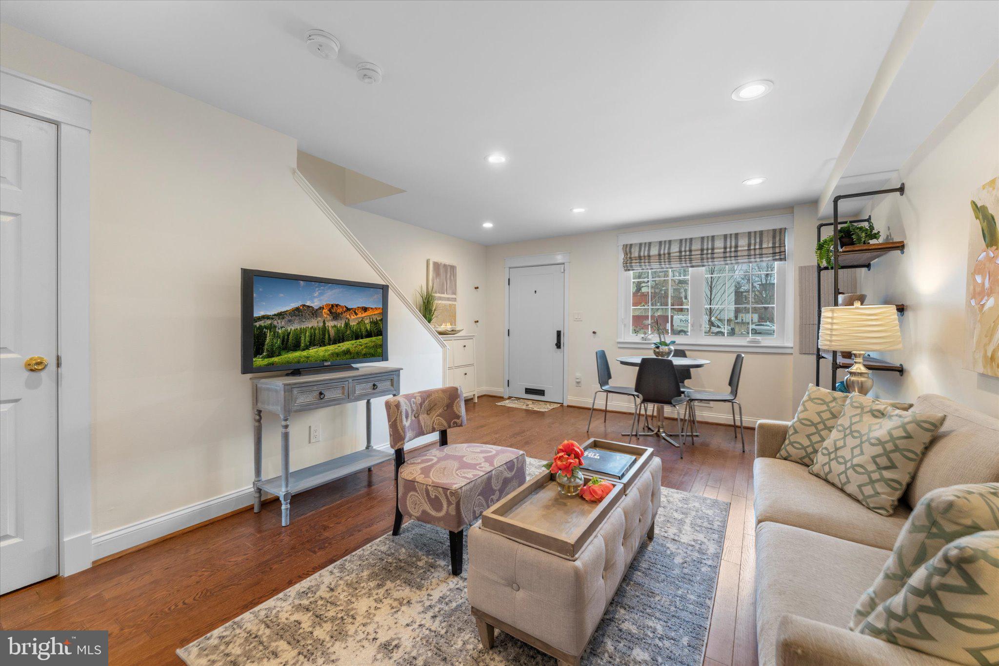 1527 K Street Southeast Washington, DC 20003 - Photo 8 of 27 a living room with furniture and a flat screen tv