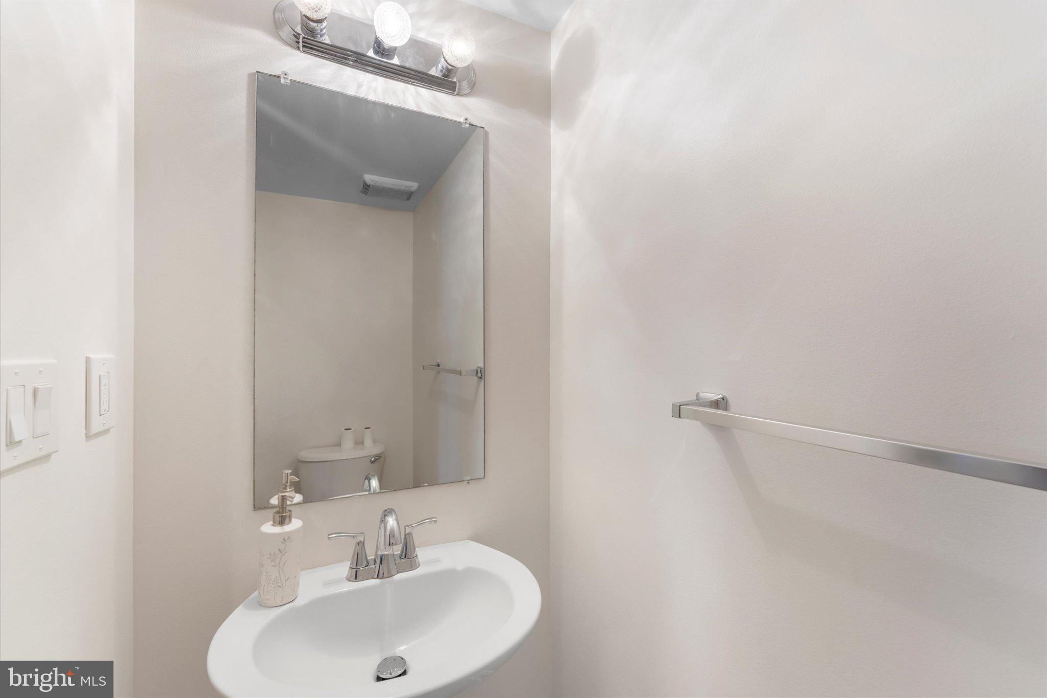 1527 K Street Southeast Washington, DC 20003 - Photo 9 of 27 a bathroom with a sink and a mirror