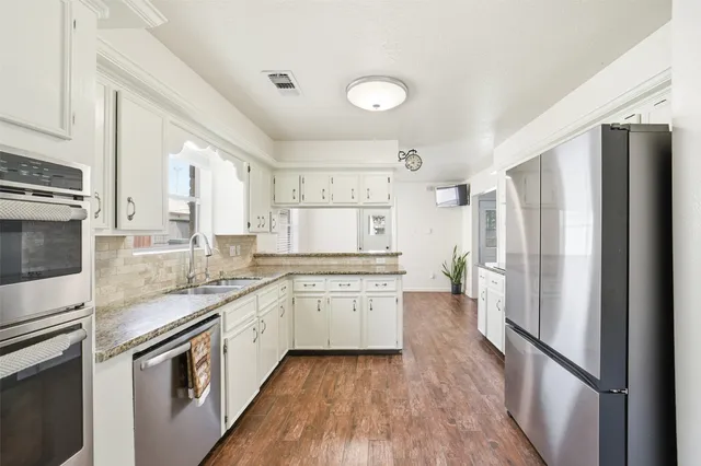 a view of entryway with wooden floor