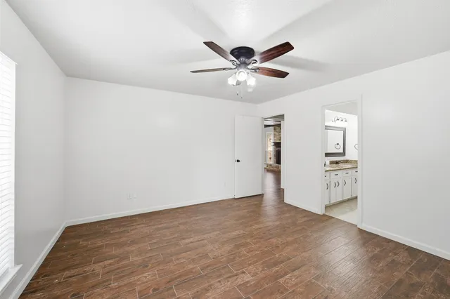 a bathroom with a sink vanity granite and a mirror