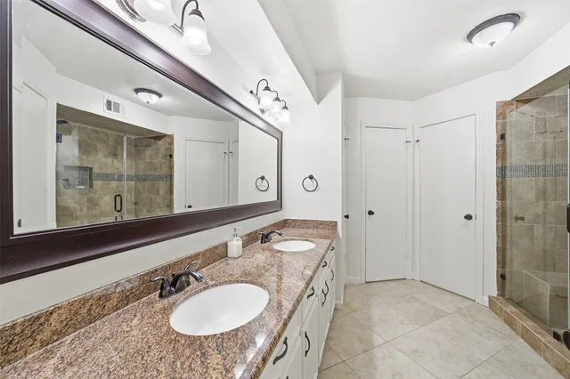 a bathroom with a white bath tub and a shower