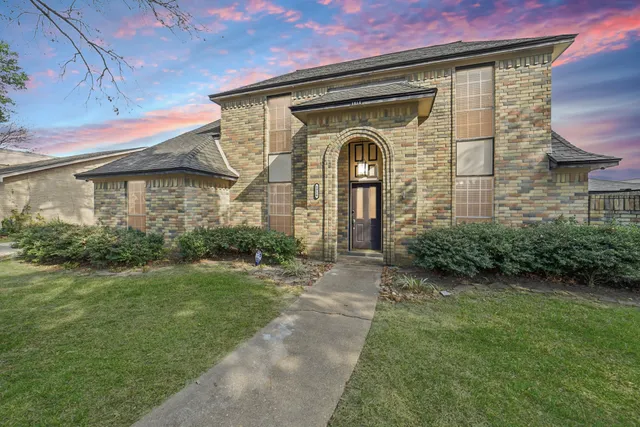 a kitchen with stainless steel appliances granite countertop a sink and a refrigerator