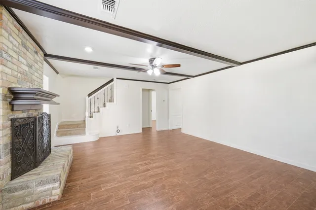 a kitchen with granite countertop a sink cabinets and stainless steel appliances