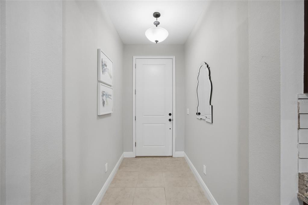 2013 Sunset Wind Loop Oldsmar, FL 34677 - Photo 9 of 43 a view of a bathroom from a hallway