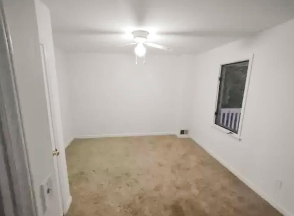 1359 Old Well Road Spencer, VA 24165 - Photo 4 of 8 a view of an empty room with a window