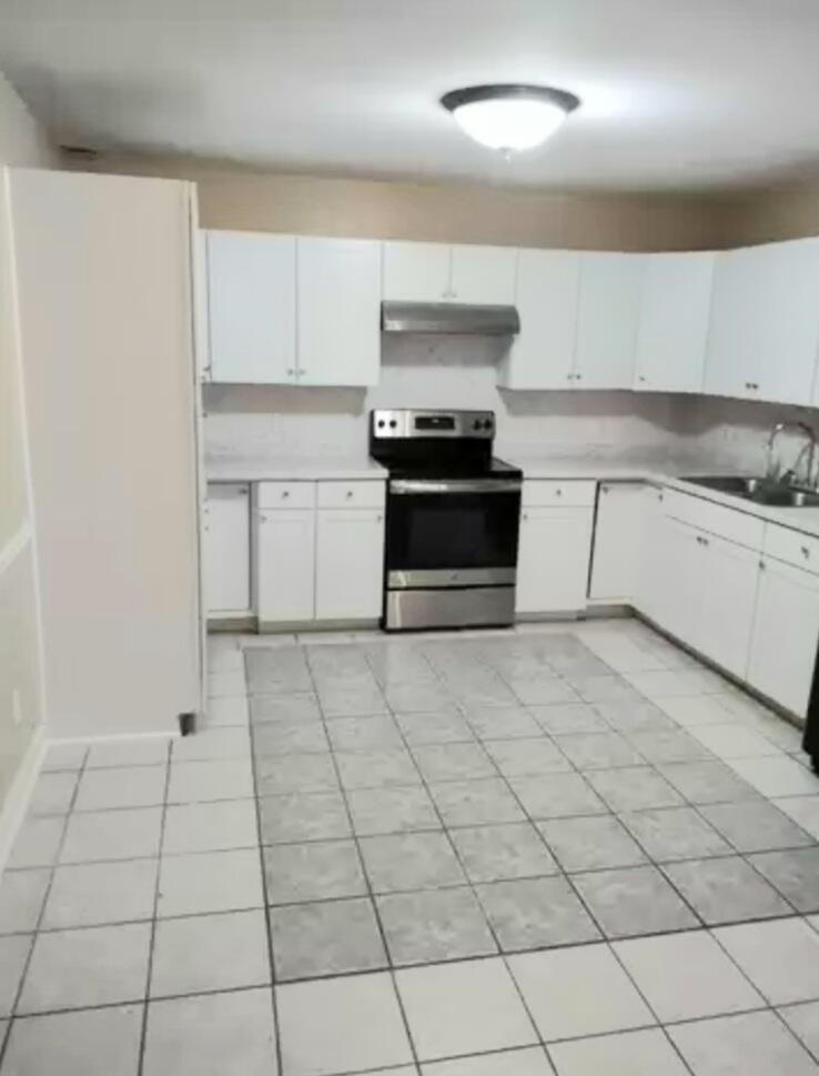 1359 Old Well Road Spencer, VA 24165 - Photo 6 of 8 a kitchen with a stove top oven sitting inside of a kitchen