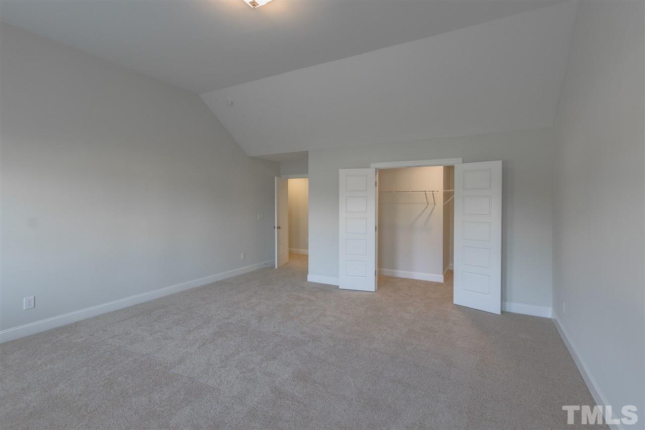 6701 Lucado Court Raleigh, NC 27603 - Photo 21 of 25 This bonus room has a huge walk in storage area to clean the clutter that always seems to make its way into our living area. photo is for reference to floor plan only